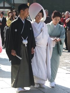 Groom, bride and matchmaker